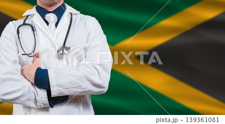 Male doctor with stethoscope on Jamaican flag. Doctor holding stethoscope on Jamaica flag 139361081