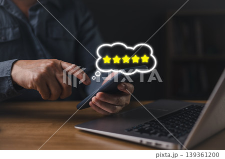 Customer quality review and satisfaction concept,hand hold smartphone with five star in bubble.Excellent service rating, user feedback,product standard,good experience survey,digital communication. 139361200