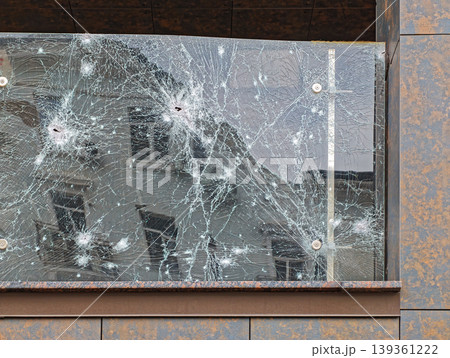 Damaged armored glass fence Damaged armored glass fence 139361222