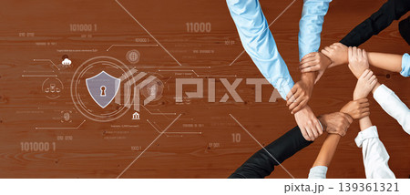 Collaborative Teamwork Emphasizing Security and Protection in a Digital Environment with Diverse Hands Joining in Unity on a Wooden Table Trope 139361321