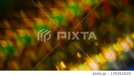 Spectrum bokeh. Reflection prism overlay. Colorful bright shimmering flare glow on dark abstract background. Striped light beam blur texture. Spectrum bokeh. Reflection prism overlay. Colorful bright shimmering flare glow on dark abstract background. Striped light beam blur texture. 139361629