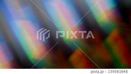 Blur prism light. Holographic flare. Colorful kaleidoscopic beam crystal glass reflection. Rainbow twinkle abstract art background. Blur prism light. Holographic flare. Colorful kaleidoscopic beam crystal glass reflection. Rainbow twinkle abstract art background. 139361648