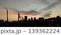 Festive Sunset in a City Square with Red and White Flags 139362224