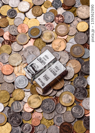 A silver bar, white metal against a backdrop of money, as a concept for the sales. A silver bar A silver bar, white metal against a backdrop of money, as a concept for the sales. A silver bar 139362990