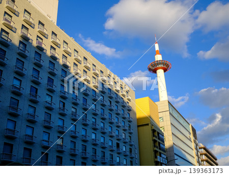 Low angle view of Kyoto Tower with blue sky, Kyoto, Japan. Kyoto, Japan cityscape. Travel concept. Kyoto tower is the tallest building and a major tourist attraction in Kansai region in Japan. Low angle view of Kyoto Tower with blue sky, Kyoto, Japan. Kyoto, Japan cityscape. Travel concept. Kyoto tower is the tallest building and a major tourist attraction in Kansai region in Japan. 139363173