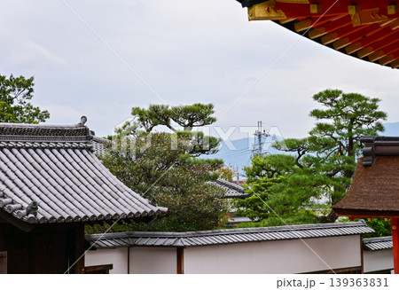 The nature view from Fushimi Inari Taisha(Fushimi Inari Shrine) in Kyoto, Japan. Fushimi Inari Shrine is a popular tourist destination. Stunning nature view of Kyoto. Trees, sky and architecture. The nature view from Fushimi Inari Taisha(Fushimi Inari Shrine) in Kyoto, Japan. Fushimi Inari Shrine is a popular tourist destination. Stunning nature view of Kyoto. Trees, sky and architecture. 139363831