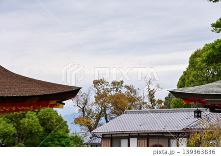 The nature view from Fushimi Inari Taisha(Fushimi Inari Shrine) in Kyoto, Japan. Fushimi Inari Shrine is a popular tourist destination. Stunning nature view of Kyoto. Trees, sky and architecture. The nature view from Fushimi Inari Taisha(Fushimi Inari Shrine) in Kyoto, Japan. Fushimi Inari Shrine is a popular tourist destination. Stunning nature view of Kyoto. Trees, sky and architecture. 139363836