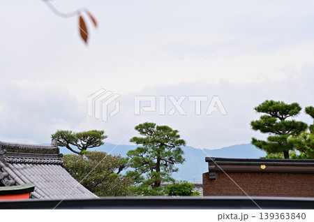The nature view from Fushimi Inari Taisha(Fushimi Inari Shrine) in Kyoto, Japan. Fushimi Inari Shrine is a popular tourist destination. Stunning nature view of Kyoto. Trees, sky and architecture. The nature view from Fushimi Inari Taisha(Fushimi Inari Shrine) in Kyoto, Japan. Fushimi Inari Shrine is a popular tourist destination. Stunning nature view of Kyoto. Trees, sky and architecture. 139363840