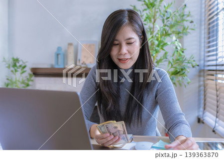 woman working from home concept saving money for finance accounting. woman working from home concept saving money for finance accounting. 139363870