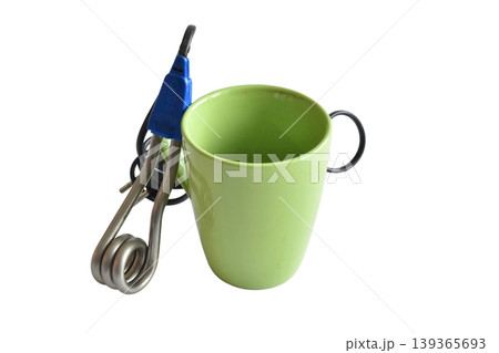 Electric kettle or immersion heater with a mug. Electric kettle or immersion heater with a mug. 139365693