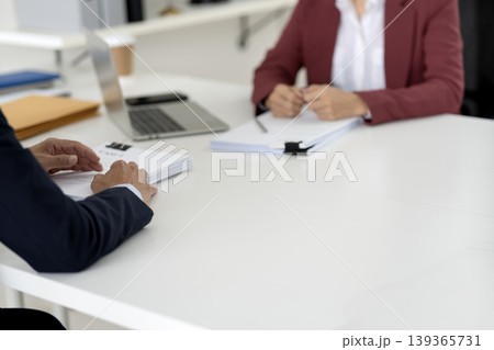 Adult business professional hands review documents office meeting project discussion collaboration desk workspace work productivity agreement 139365731