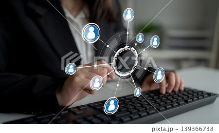 Business Professional Engaging with Digital Network Connections through Keyboard and Virtual User Icons in Modern Workspace Environment Crux Business Professional Engaging with Digital Network Connections through Keyboard and Virtual User Icons in Modern Workspace Environment Crux 139366738