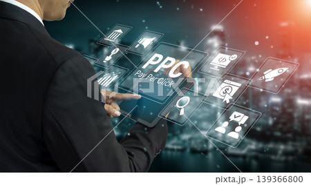 Businessman interacting with digital interfaces showcasing Pay Per Click marketing strategies and analytics in modern office environment at night Ledger Businessman interacting with digital interfaces showcasing Pay Per Click marketing strategies and analytics in modern office environment at night Ledger 139366800