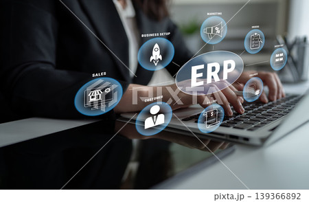 Business Professional Engaging with Modern Technology and ERP Software on Laptop with Various Business Icons Representing Strategy and Sales Growth Quark Business Professional Engaging with Modern Technology and ERP Software on Laptop with Various Business Icons Representing Strategy and Sales Growth Quark 139366892