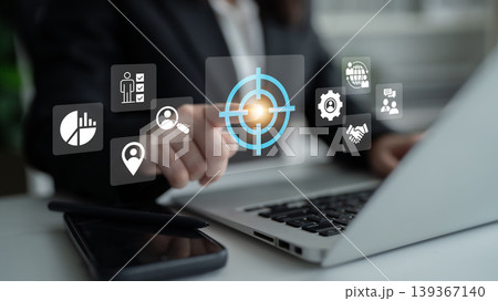 Business Professional Engaging with Virtual Technology to Analyze Data and Improve Strategies in a Modern Office Environment Ledger 139367140