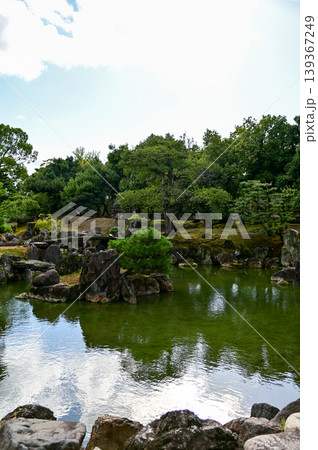 The Japanese gardern view of nijo jo castle, Kyoto, Japan. World Heritage Site, Japanese old traditional architecture in Kyoto, Japan. Background landscape of the beauty of Nijo Castle at sunny day. The Japanese gardern view of nijo jo castle, Kyoto, Japan. World Heritage Site, Japanese old traditional architecture in Kyoto, Japan. Background landscape of the beauty of Nijo Castle at sunny day. 139367249