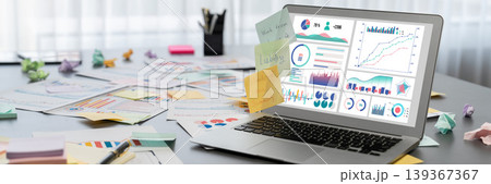 Sticky note for creative and analytic brainstorm with BI data on laptop. Prodigy 139367367