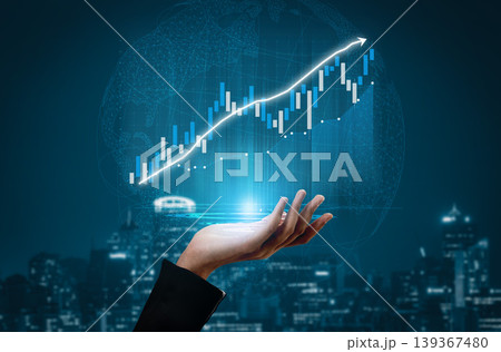 Hand Holding Light Symbolizing Growth and Progress with Financial Graph in Dark Cityscape Background Impute 139367480