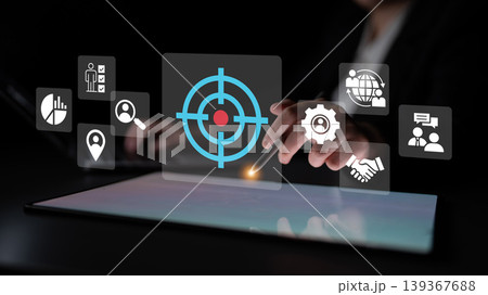 Hands Using Touchscreen Device with Interface Overlays Representing Targeting, Data Analysis, Collaboration, and Global Communication Ledger 139367688