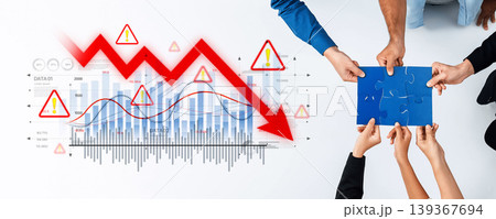 Team Collaboration in Crisis Management with Graphs Highlighting Financial Decline and Visual Problem-Solving Techniques Trope Team Collaboration in Crisis Management with Graphs Highlighting Financial Decline and Visual Problem-Solving Techniques Trope 139367694