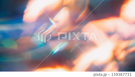 Blur reflection glow. Crystal prism. Colorful light abstract background. Neon spectrum luminosity orange blue green twinkle flash. Blur reflection glow. Crystal prism. Colorful light abstract background. Neon spectrum luminosity orange blue green twinkle flash. 139367731