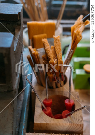 Paint brushes. Workshop tools. Collection of carpentry supplies organized on workbench in repair craft studio with industrial equipment. Paint brushes. Workshop tools. Collection of carpentry supplies organized on workbench in repair craft studio with industrial equipment. 139367754