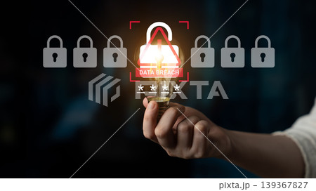 Hand Holding Light Bulb Symbolizing Cybersecurity Focus on Data Breach Prevention Against Hacking with Padlock Icons and Glowing Light Ledger 139367827