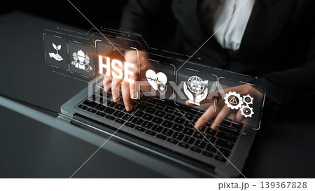 A business professional engages with technology on a laptop, showcasing health, safety, and environment concepts through elegant digital icons, emphasizing sustainability in modern practices. Sigmoid 139367828