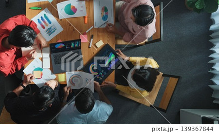 Top view of smart team working together while talking about chart. Convocation. 139367844