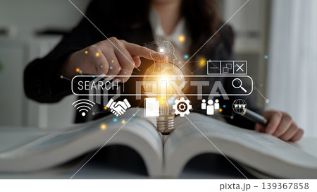 Person in Business Attire Searching for Information Using a Digital Search Bar with Light Bulb Concept in the Background Quark Person in Business Attire Searching for Information Using a Digital Search Bar with Light Bulb Concept in the Background Quark 139367858