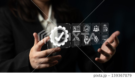 A business professional engages with a digital interface, indicating concepts of data analytics and management strategies through interactive icons, enhancing workflow and productivity. Sigmoid A business professional engages with a digital interface, indicating concepts of data analytics and management strategies through interactive icons, enhancing workflow and productivity. Sigmoid 139367879