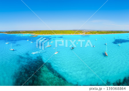 Aerial view of yachts and boats anchored in azure bay with crystal clear water on coast of Mallorca Aerial view of yachts and boats anchored in azure bay with crystal clear water on coast of Mallorca 139368864