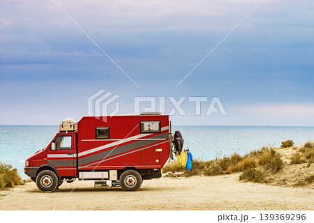 Lorry motorhome with equipment camping on beach Lorry motorhome with equipment camping on beach 139369296