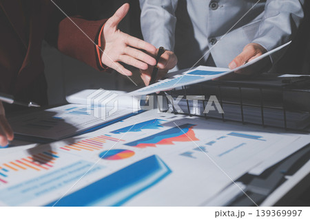 business people or accountant using calculator while working analytical business report on the workplace, accounting concept, Serious and focused financier accountant on paper work inside office, business people or accountant using calculator while working analytical business report on the workplace, accounting concept, Serious and focused financier accountant on paper work inside office, 139369997