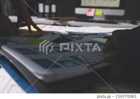 Team of Program Developer Collaborating on UXUI Design Planning in a Modern Office Environment 139370063