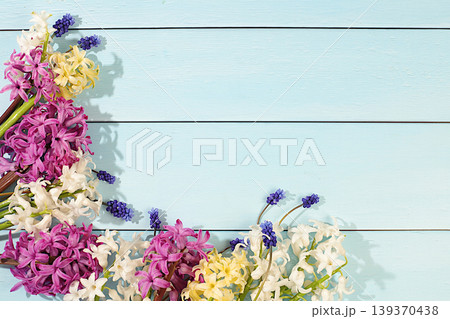 Beautiful flyer with white, burgundy, and purple hyacinths and blue muscari on an elegant, vibrant background.Abstract floral arrangement of spring flowers for web design and templates. Beautiful flyer with white, burgundy, and purple hyacinths and blue muscari on an elegant, vibrant background.Abstract floral arrangement of spring flowers for web design and templates. 139370438