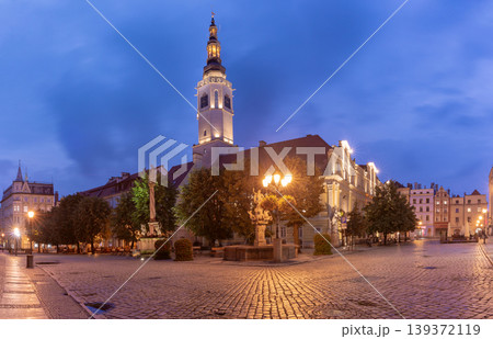 Market square in Swidnica Poland at blue hour with town hall tower and illuminated street Market square in Swidnica Poland at blue hour with town hall tower and illuminated street 139372119