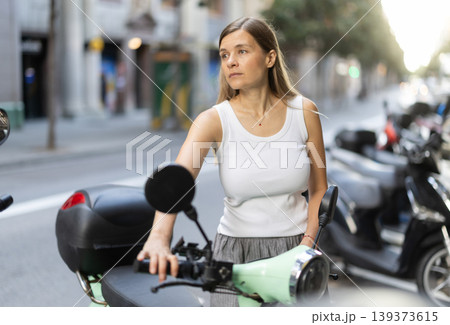 Woman rents moped, starts journey at parking lot 139373615