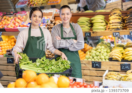 Portrait of two positive female salespeople in grocery supermarket Portrait of two positive female salespeople in grocery supermarket 139373709