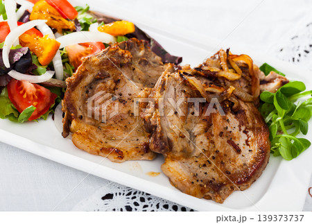 Grilled pork chop with salad Grilled pork chop with salad 139373737
