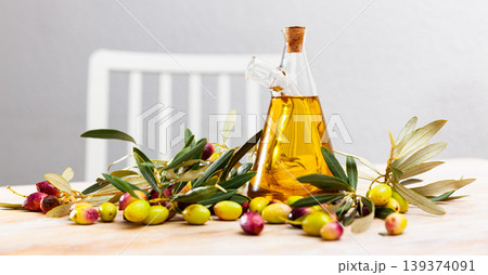 Olive oil in mug on wooden table Olive oil in mug on wooden table 139374091
