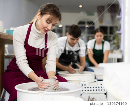 Woman working with pottery wheel Woman working with pottery wheel 139374160