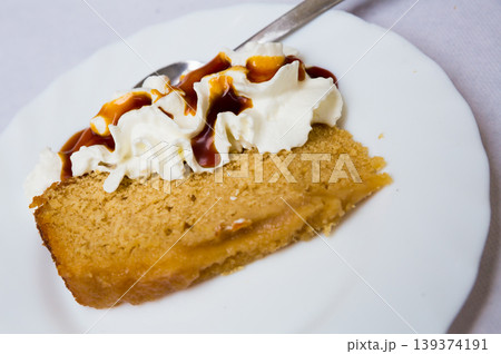 Cake slice with whipped cream Cake slice with whipped cream 139374191