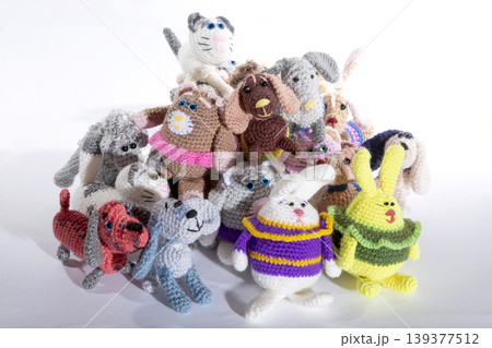 Various knitted woolen toys on a white background Various knitted woolen toys on a white background 139377512