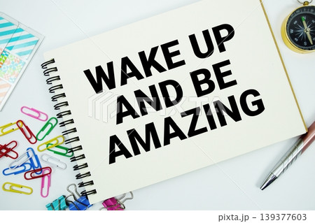 Wake Up and Be Amazing text message written on notepad with stationery flat lay on white background Wake Up and Be Amazing text message written on notepad with stationery flat lay on white background 139377603