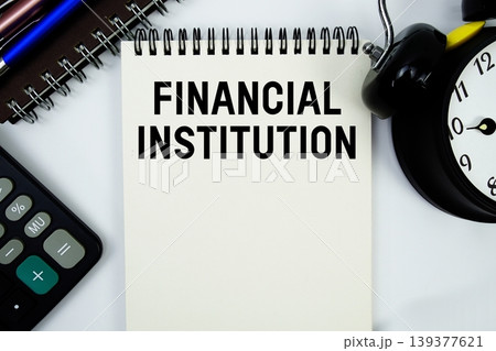 Financial Institution text written on notepad with calculator and alarm clock Financial Institution text written on notepad with calculator and alarm clock 139377621