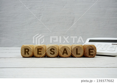 RESALE alphabet letters with calculator on wooden background RESALE alphabet letters with calculator on wooden background 139377682