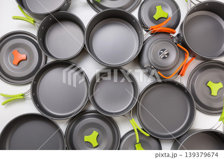 Flat lay composition of grey tourist pots and pans as a background for outdoor themes. 139379674