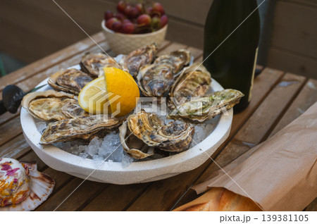 Fresh Raw Oysters with Citron, Baguette, Butter, and Cider Fresh Raw Oysters with Citron, Baguette, Butter, and Cider 139381105