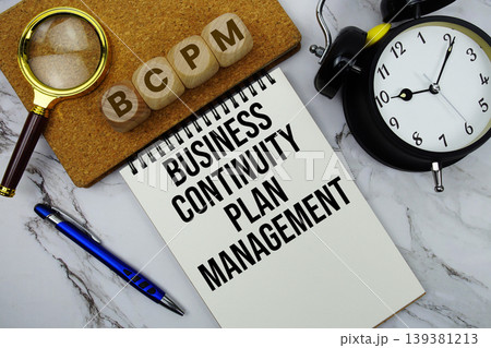 BCPM Business Continuity Plan Management text written on notepad with calculator and magnifying glass on marble background BCPM Business Continuity Plan Management text written on notepad with calculator and magnifying glass on marble background 139381213